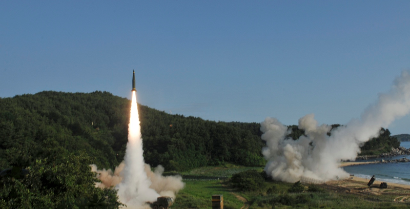 In this photo provided by Eighth U.S. Army, South Korea’s Hyunmoo Missile II, left, and U.S. MGM-140 Army Tactical Missile, right, are fired into the east sea during the combined military exercise against North Korea at an undisclosed location in South Korea, Wednesday, July 5, 2017 (Eighth U.S. Army via AP)